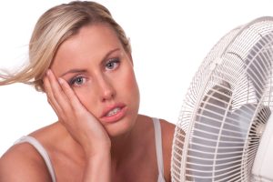 woman-who-is-too-hot-in-front-of-fan