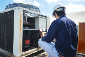 Technician is checking air conditioner